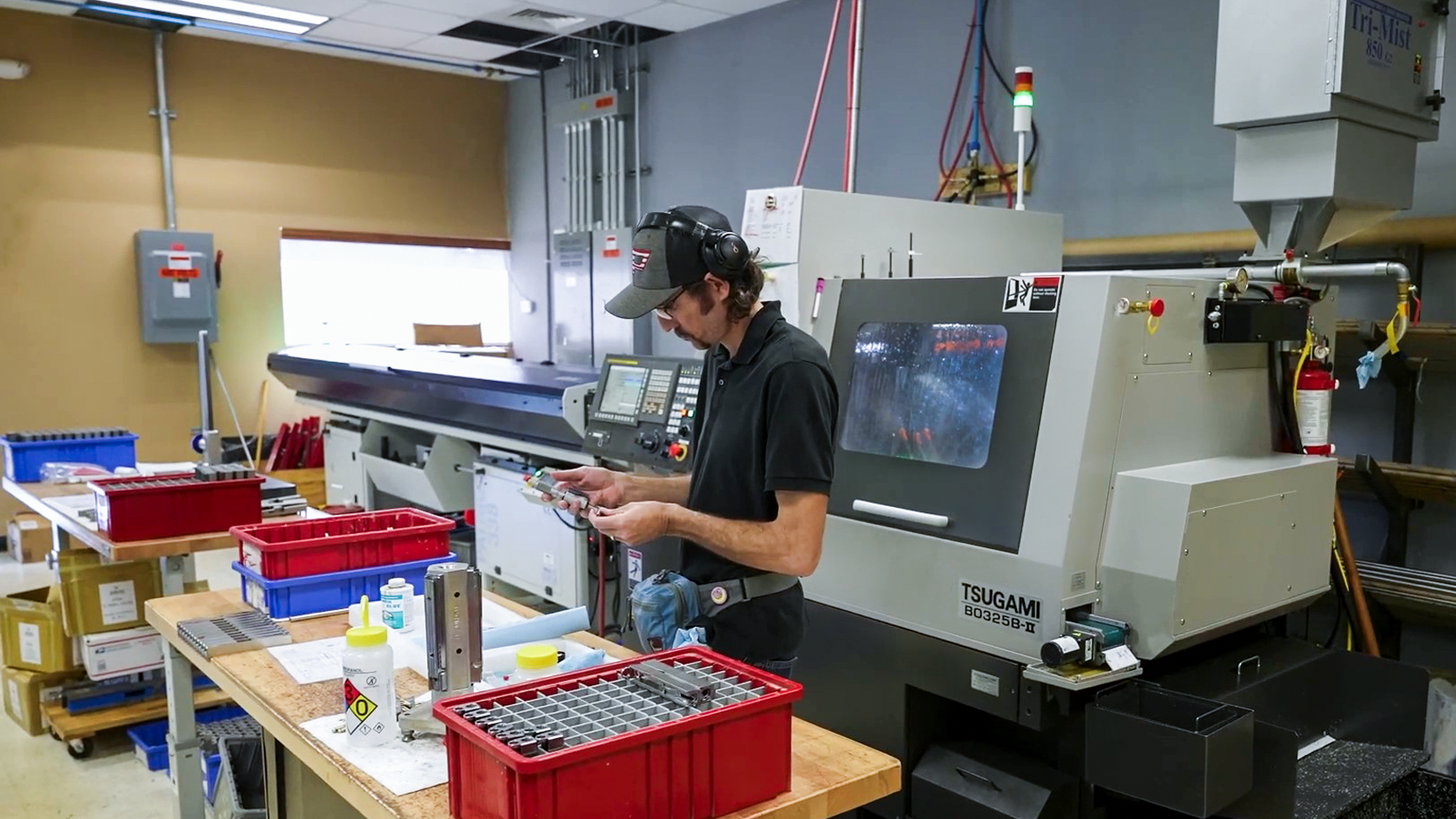 Zaffiri Precision - Worker Inspecting Part